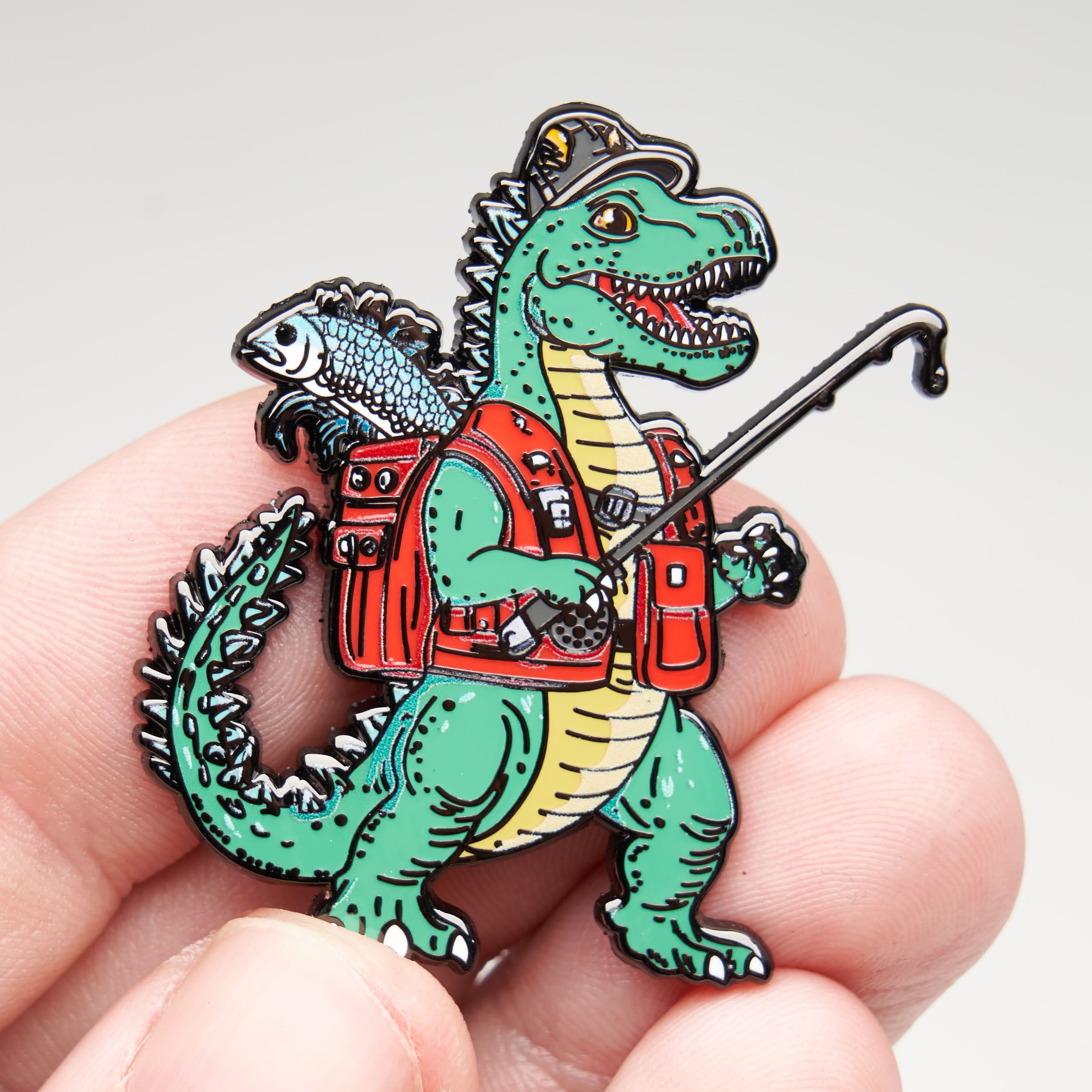 Dinosaur Fisherman Pin - Image 2